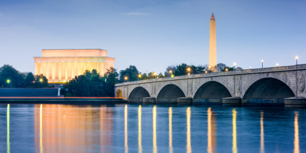 Washington DC, USA skyline on the Potomac River with Lincoln Memorial, Washington Monument, and Arlington Memorial Bridge.