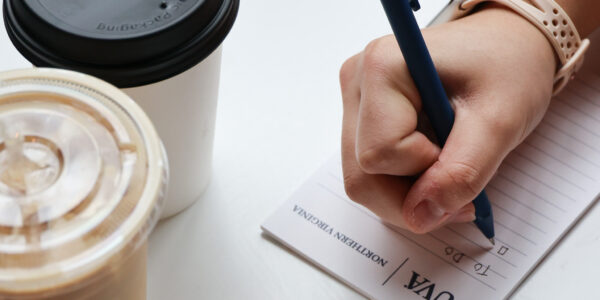 Woman writing on note pad