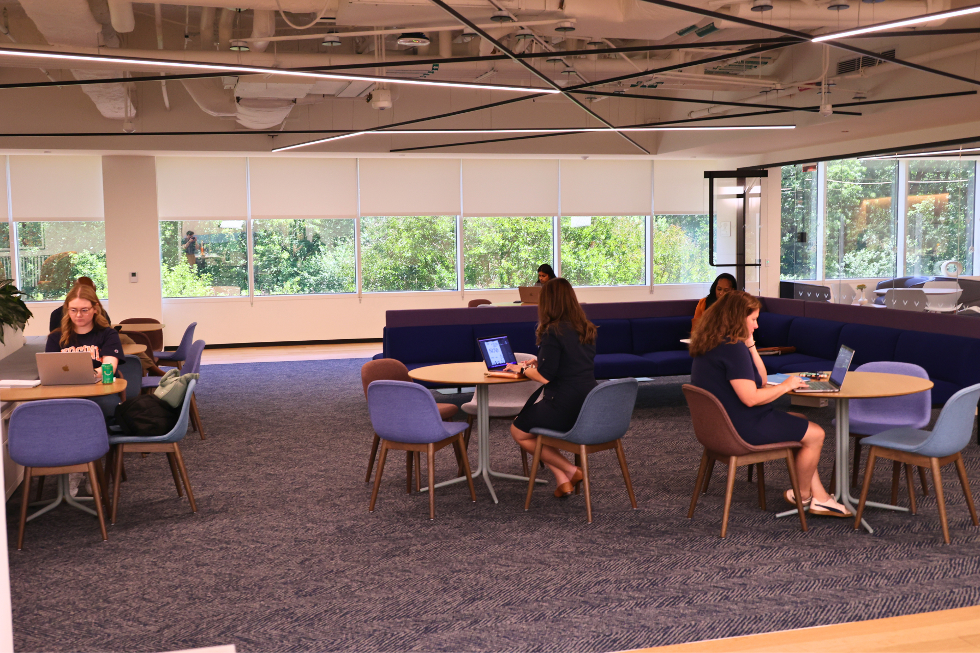 Students work on laptops in the Open Flex Space.